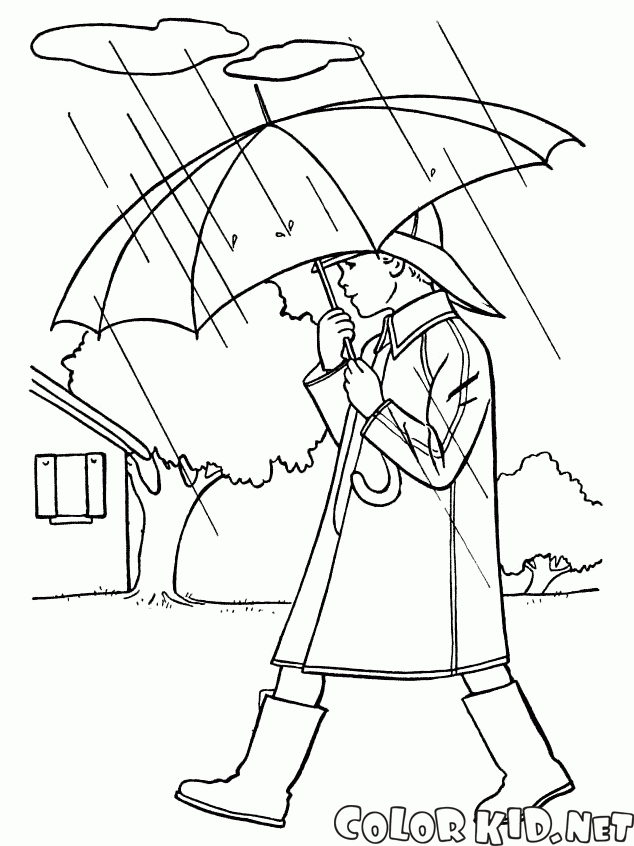Oğlan yağmurda yürüyor